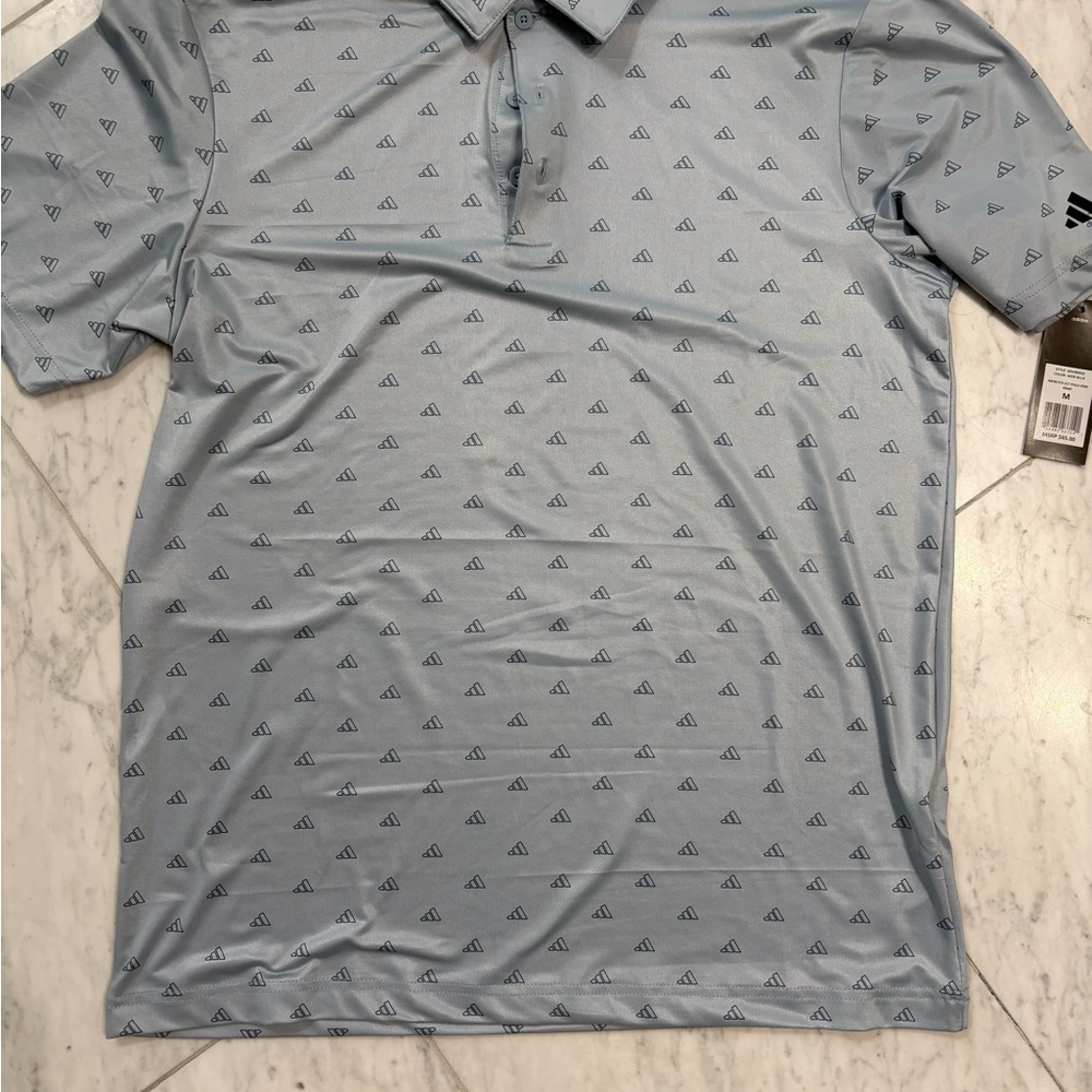 NWT. Men’s Medium Light Blue Adidas Golf Shirt.